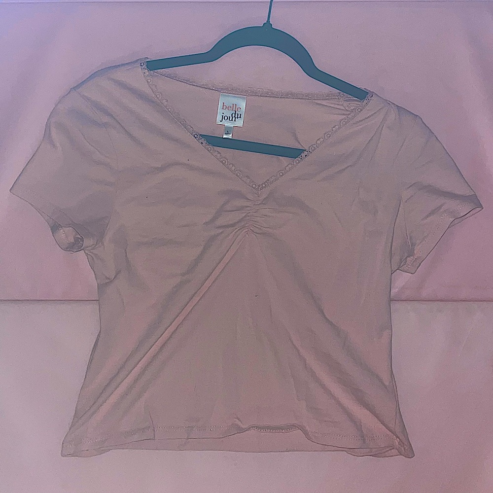 pink crop top with a lace trim.